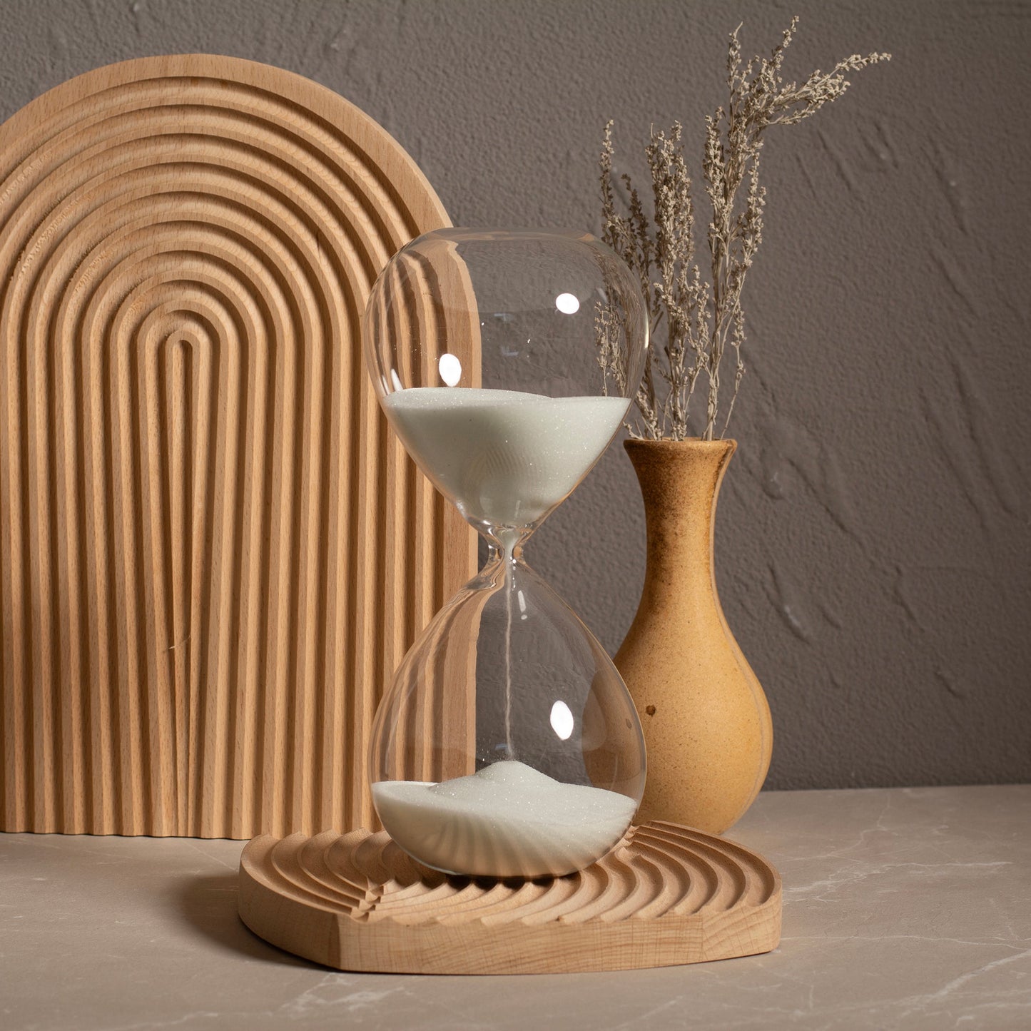 Close-up of sand timer showing premium glass and flowing sand detail