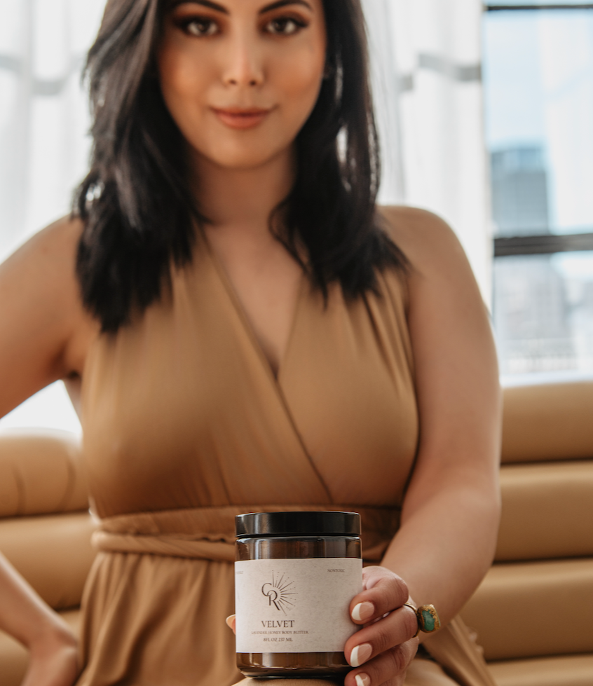Woman applying Velvet Lavender Honey Body Butter during self-care routine