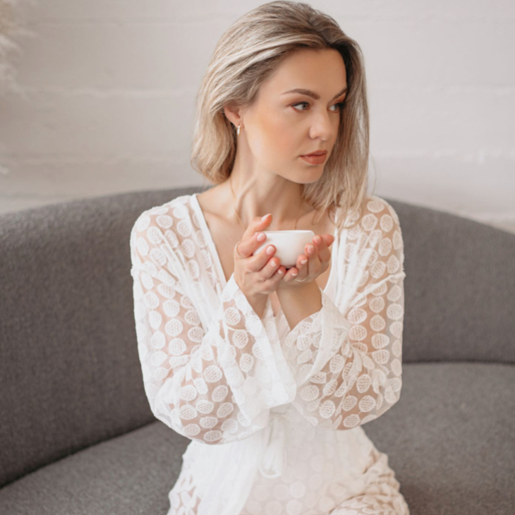 Woman sipping Relax Loose Leaf Tea during peaceful evening routine