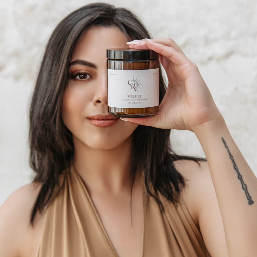 Woman applying Velvet Lavender Honey Body Butter during self-care routine