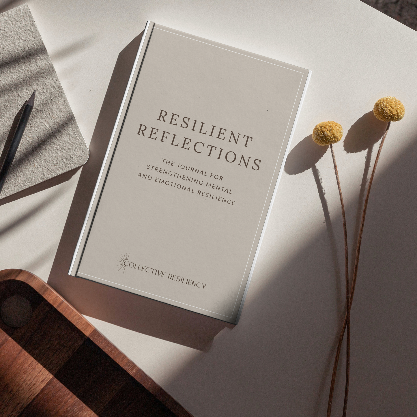Resilient Reflection Journal in morning ritual setting with tea and essential oils
