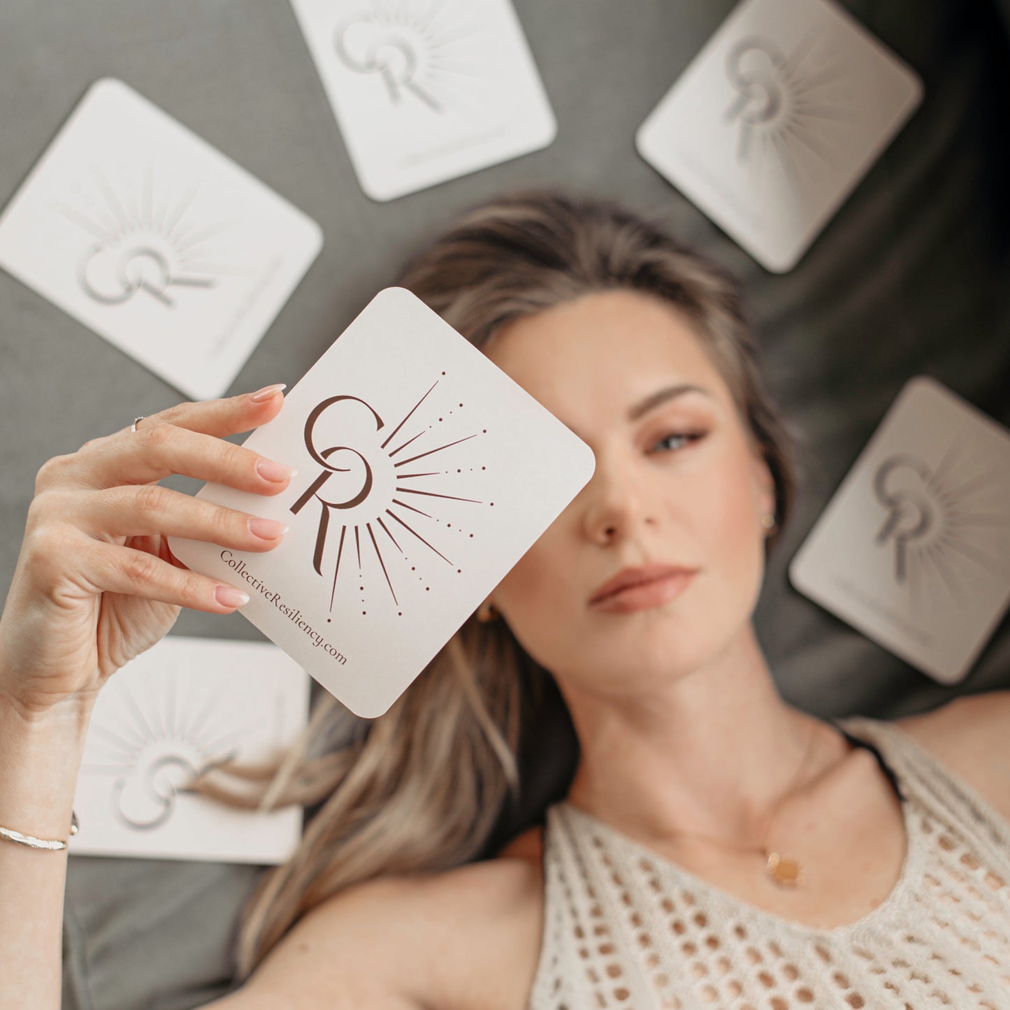 Woman drawing daily card during morning empowerment ritual

