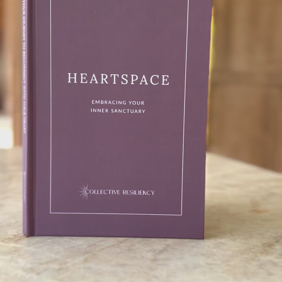 Heart Space Journal in peaceful setting with calming tea and essential oils
