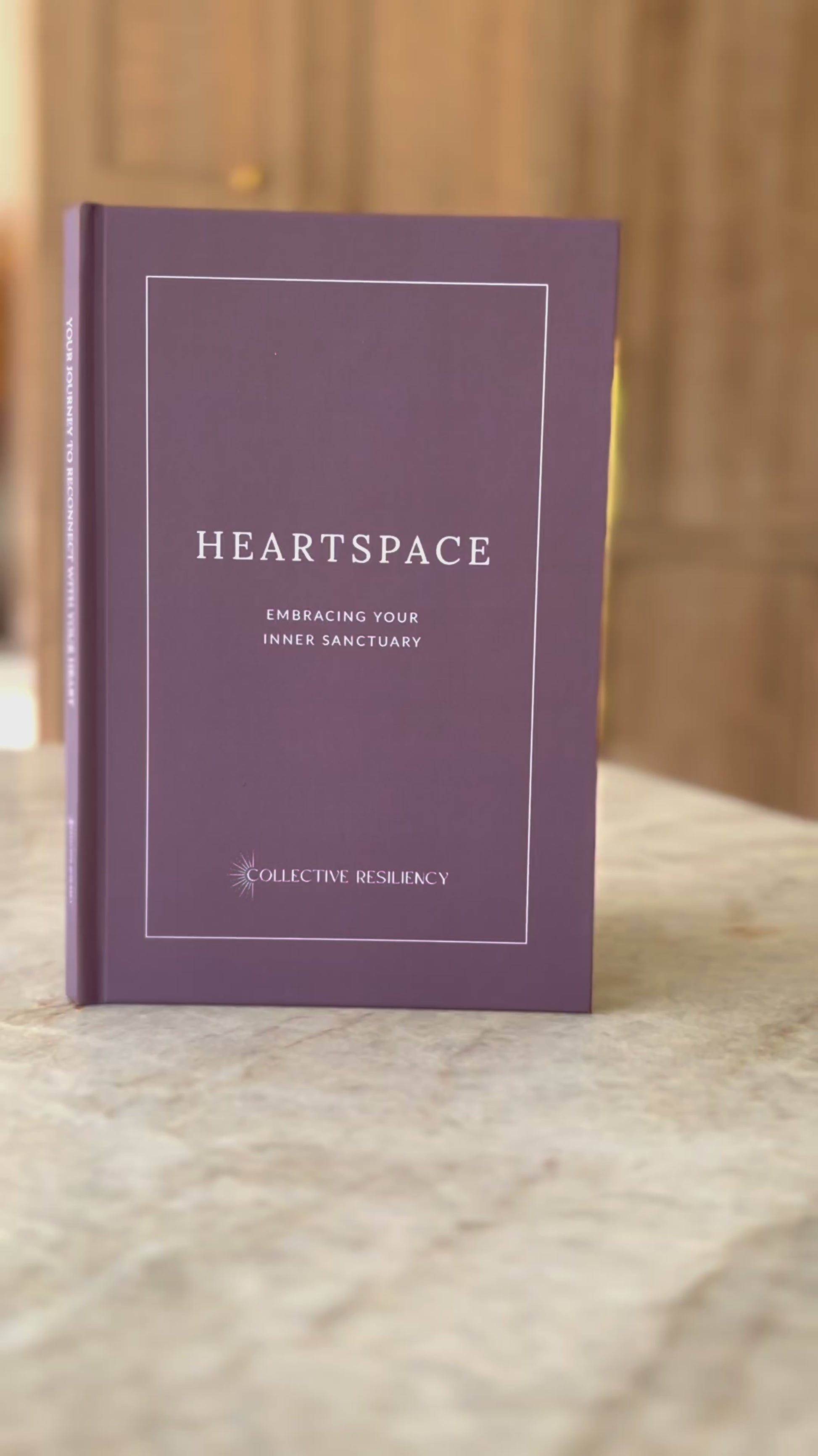 Heart Space Journal in peaceful setting with calming tea and essential oils
